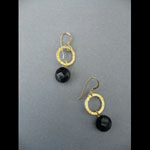 Gold rings and black onyx earrings